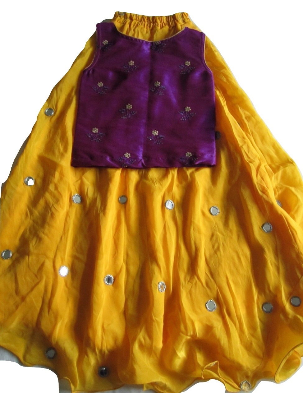 purple top yellow skirt