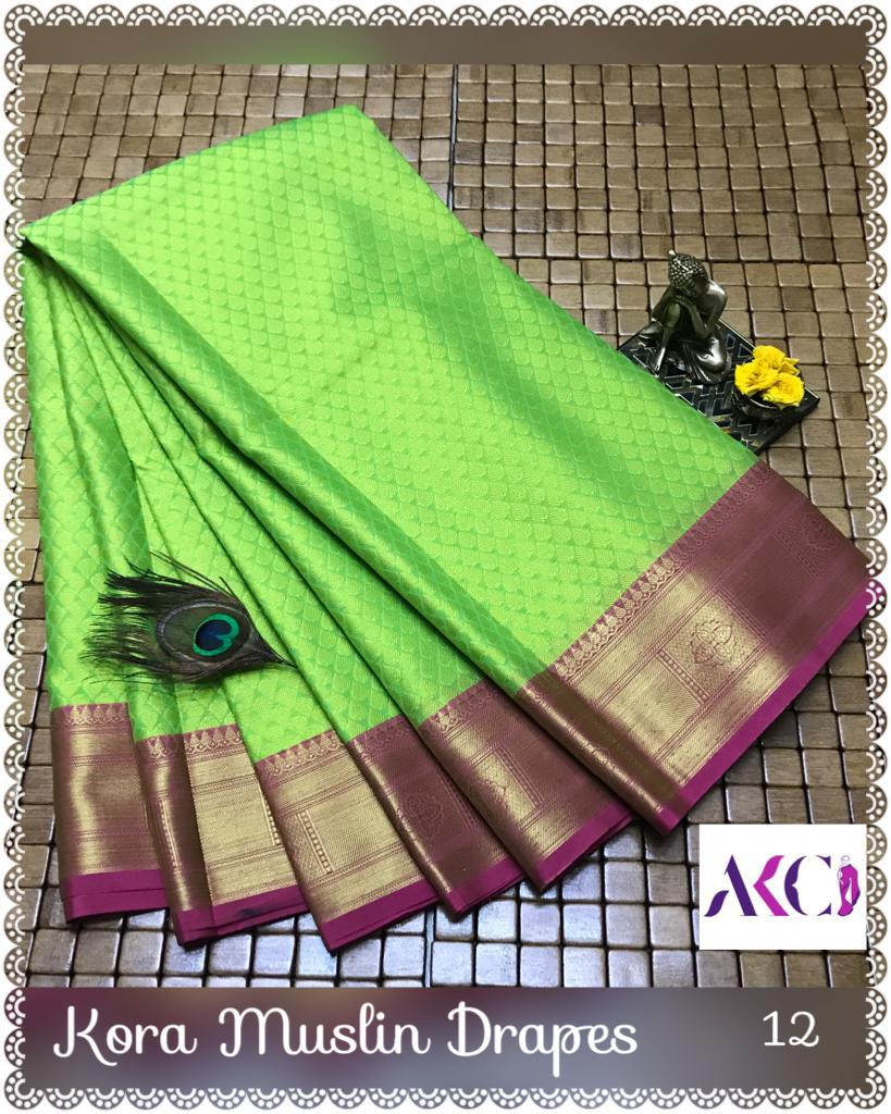 Kora Muslin Embossed Sarees Body Red Color with Green color border –  SareesZone